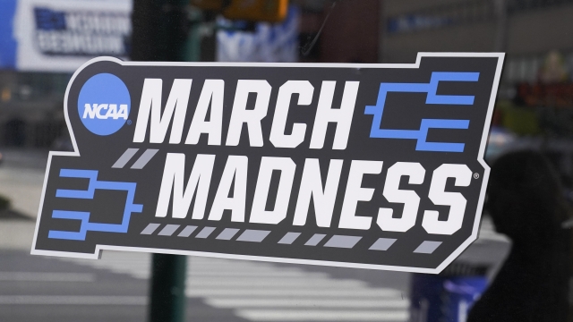 A March Madness sticker for the NCAA college basketball tournament is placed on a window in downtown Indianapolis.