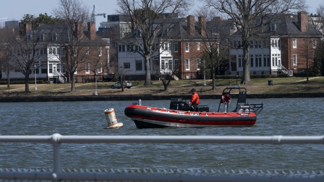 District of Columbia Fire Boat checks buoys in the waterway next to Fort McNair