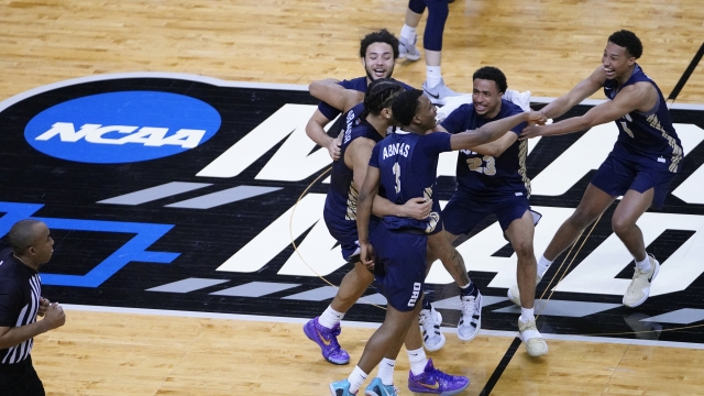 Oral Roberts players celebrate after a college basketball game against Florida in the second round of the NCAA tournament