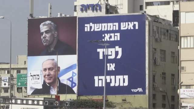 Yair Lapid and Benjamin Netanyahu on a billboard for Israel's election