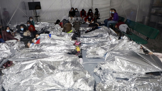 Kids lay in a crowded CBP shelter in Texas