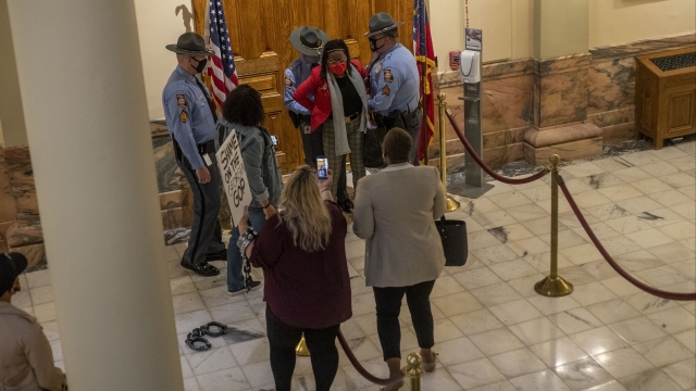 Rep. Park Cannon (D-Atlanta) is placed in handcuffs by Georgia State Troopers