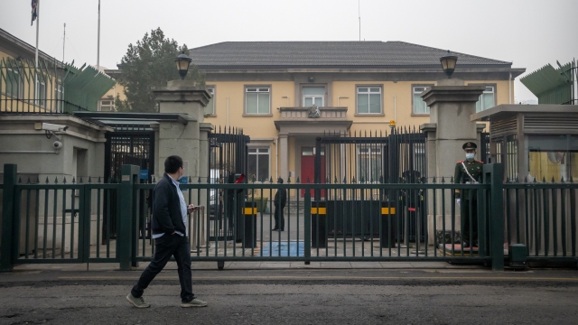 A Chinese paramilitary police officer stands guard outside the British Embassy in Beijing