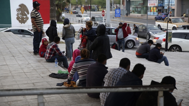 Migrants sit at Mexican border city of Reynosa