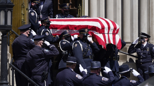 The casket carrying the body of fallen Boulder, Colo., Police Department officer Eric Talley is carried.