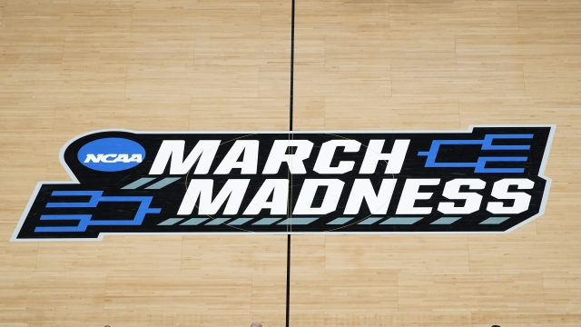 The March Madness logo is shown on the court.