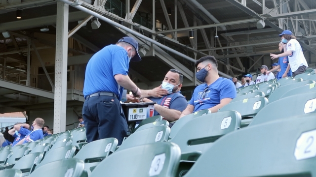 Fans buy beer at a Cubs game