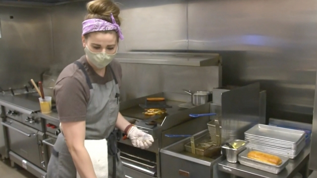 Person works in a restaurant kitchen