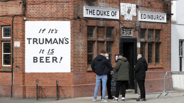 People waiting for entrance at the Duke of Edinburgh pub in London, Monday, April 12, 2021.