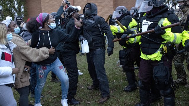 Police clash with protesters.