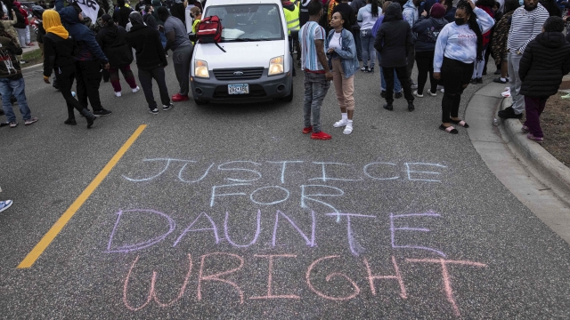 Protesters gather following the fatal police shooting of Daunte Wright in Brooklyn Center, Minneapolis.