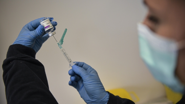 A health worker prepares a dose of the AstraZeneca vaccine.