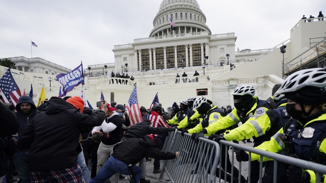 Group of protesters attempt to break through a police barrier at the U.S. Capitol in Washington, D.C.
