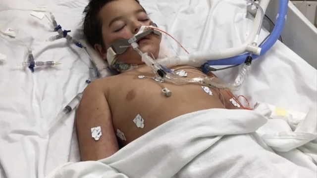 Child lays in hospital bed