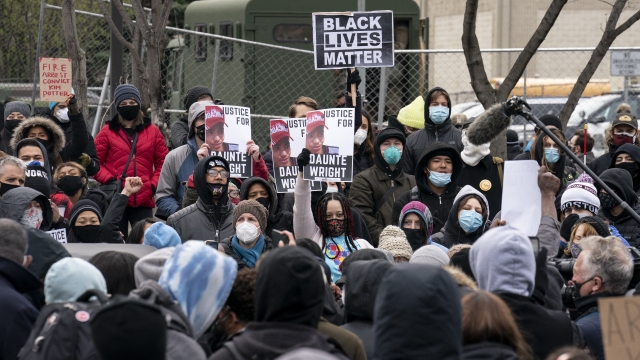 Demonstrators rally outside the Brooklyn Center Police Department