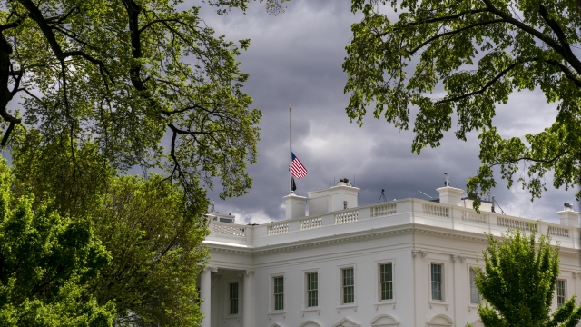 The American flag files at half-staff above the White House