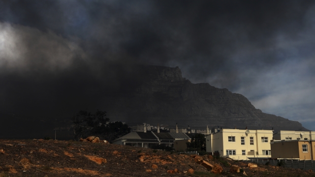 Clouds of dark smoke hang above the city of Cape Town, South Africa.