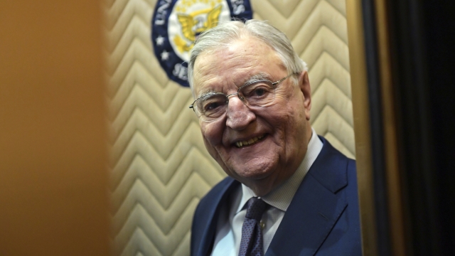 Former Vice President Walter Mondale smiles as he gets on an elevator on Capitol Hill.