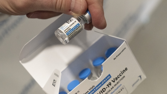 Pharmacist holds a vial of the Johnson & Johnson COVID-19 vaccine.