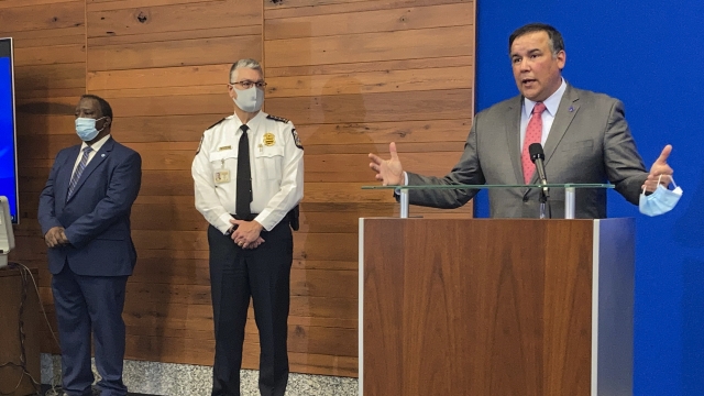Columbus Mayor Andrew Ginther, right, during a news conference about the fatal police shooting of 16-year-old Ma'Khia Bryant