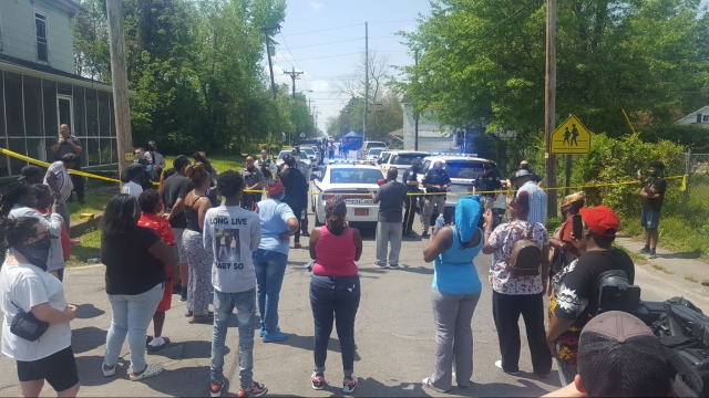Residents gather near the scene of a shooting, Wednesday, April 21, 2021 in Elizabeth City, N.C.