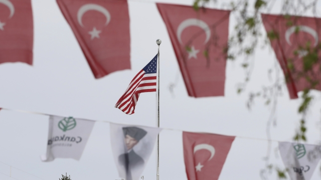 Turkish flags and banners depicting Mustafa Kemal Ataturk, the founder of modern Turkey, outside the U.S. embassy
