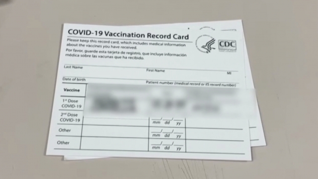 A vaccination card sits on a table.