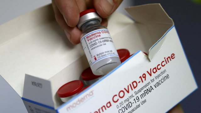 Medical staff show Moderna coronavirus vaccine during preparations at the Vaccine