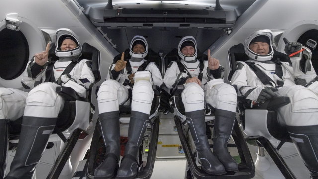 NASA astronauts Shannon Walker, left, Victor Glover, Mike Hopkins, and Japan Aerospace Exploration Agency (JAXA) astronaut