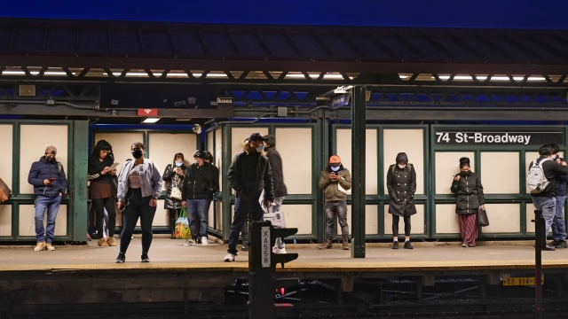 patrons wait for the #7 train at the 74th street subway station in the Queens