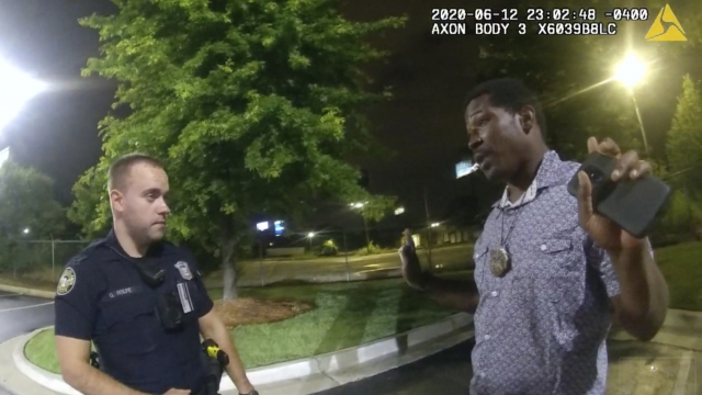 Screen grab from body camera footage of Atlanta Police Officer Garrett Rolfe speaking to Rayshard Brooks.
