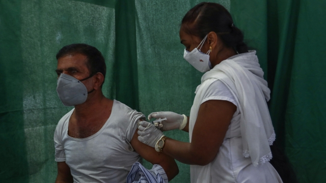 A health worker administers a vaccine for COVID-19 in Hyderabad, India