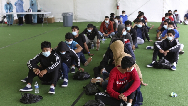 Young migrants wait to be tested for COVID-19 at the Donna Department of Homeland Security holding facility.