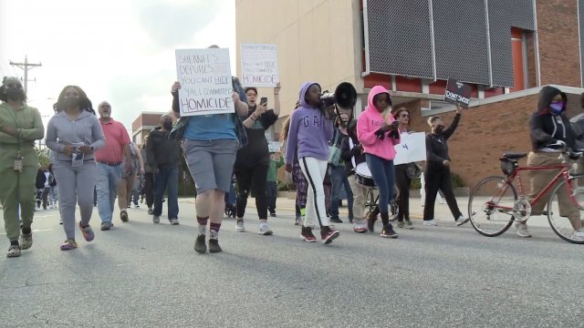 Protesters march.