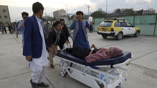 Girl is brought to a hospital after a bomb explosion near a school in west Kabul, Afghanistan, Saturday.