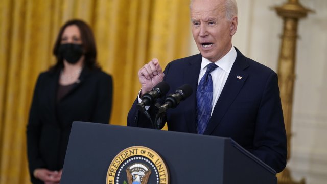 Vice President Kamala Harris listens as President Joe Biden speaks about the economy.