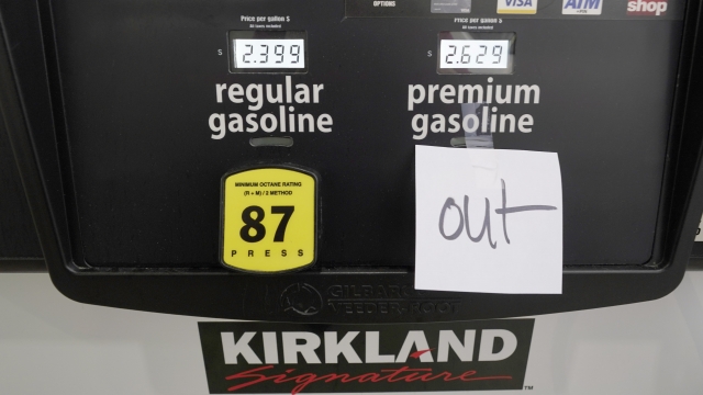 A note posted at a gas pump indicates the pump is out of premium gasoline at a Costco Warehouse fuel station in Mis