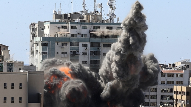 Smoke billows from a building housing international media, including The Associated Press, after an Israeli airstrike.