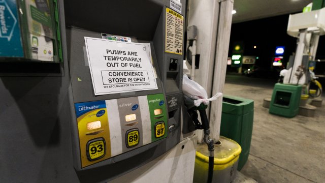 A pump at a gas station in Silver Spring, Md., is out of service, notifying customers they are out of fuel May 13, 2021.