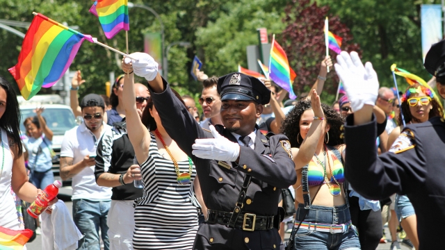 NYPD police officers march along Fifth Avenue during the gay pride parade in New York