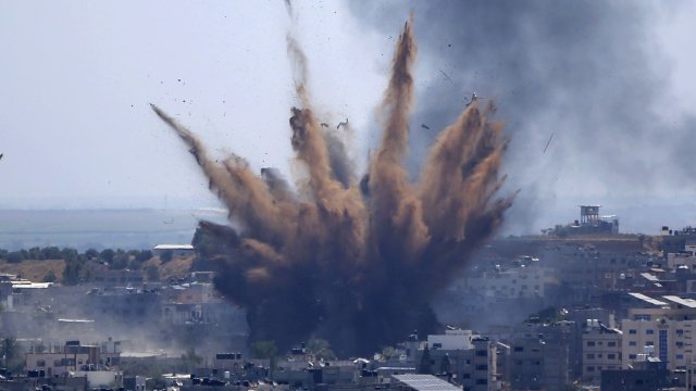 Smoke rises following Israeli airstrikes on a building in Gaza City, Thursday, May 13, 2021.