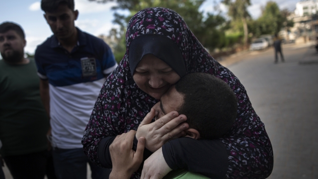 Relatives react to death of a man killed by an Israeli airstrike in Gaza City
