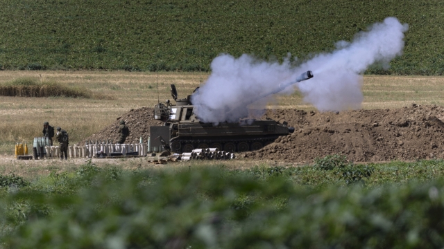 An Israeli artillery unit fires toward targets in Gaza Strip