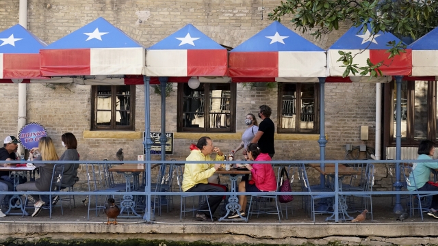 Diners eat at a restaurant on the River Walk in San Antonio, Texas.