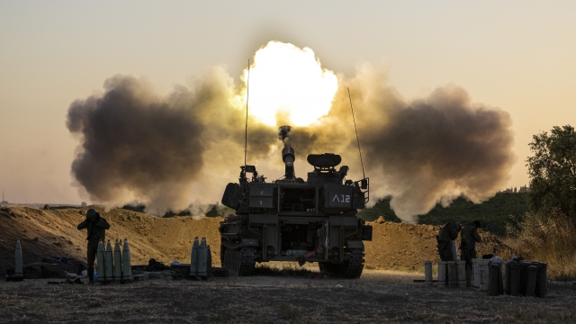 An Israeli artillery unit fires shells towards targets in Gaza Strip