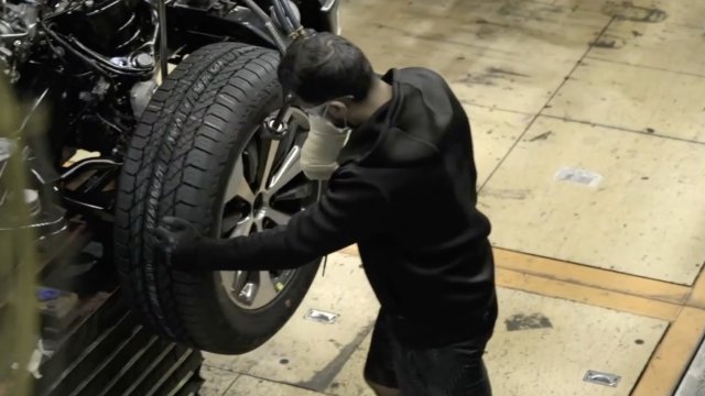 Man works on a tire.