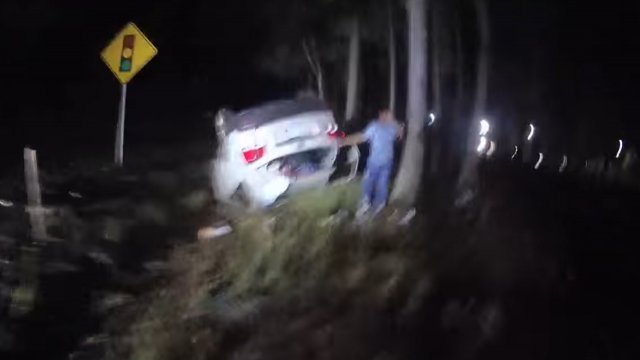 Body cam footage of an overturned vehicle.