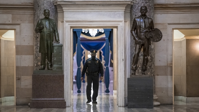 A U.S. Capitol Police officer patrols the area near the House of Representatives chamber