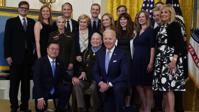 Pres. Joe Biden and South Korean Pres. Moon Jae-in pose for photo with U.S. Army Col. Ralph Puckett.