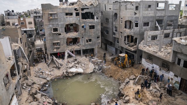 A crater full of water and sewage remains where a home once was in Gaza.